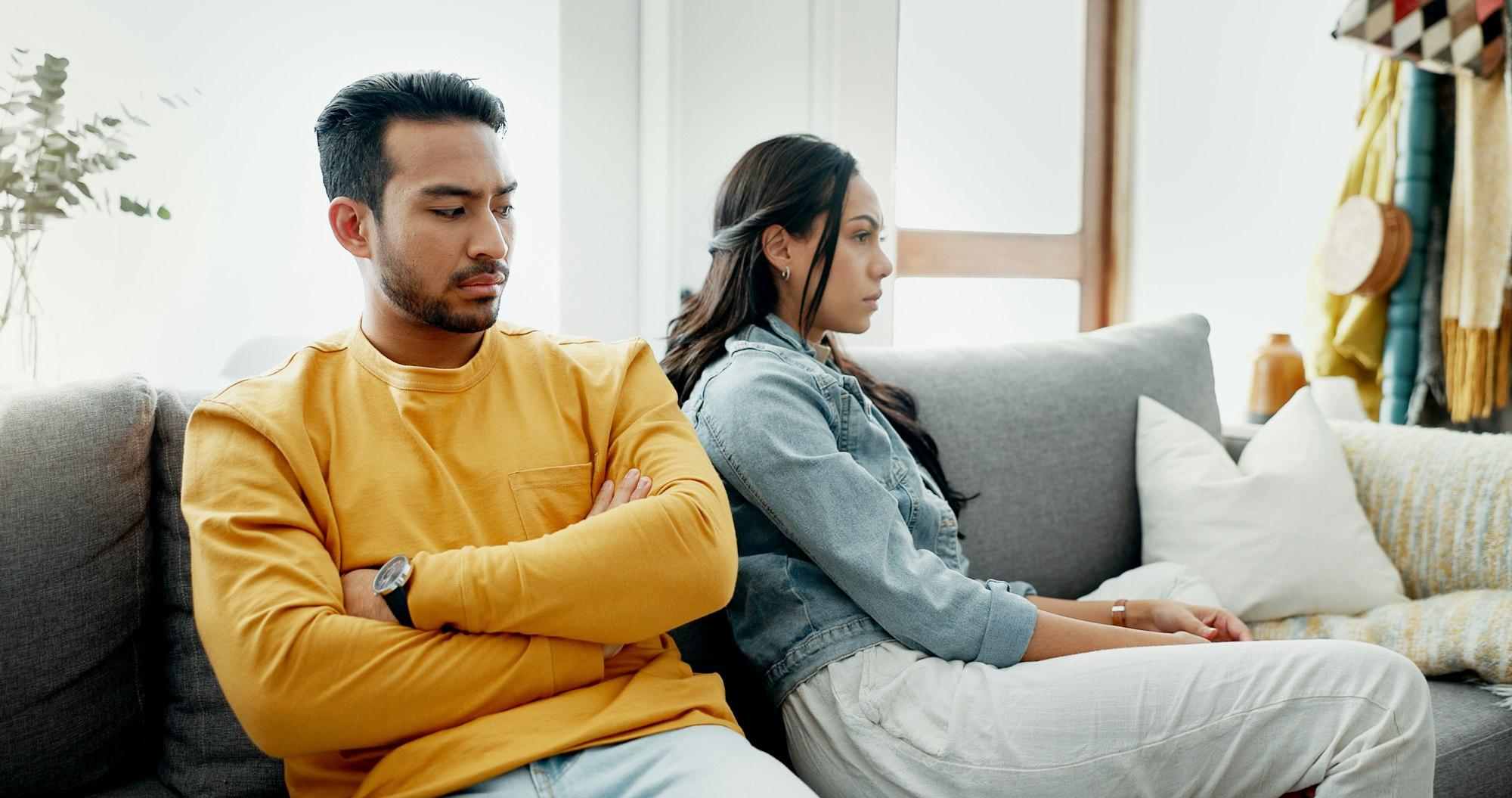 Conflict, fight and couple angry on a couch together duo to infertility, argument and toxic relatio