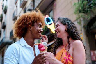 Couple of different ethnicities sharing Ice Cream