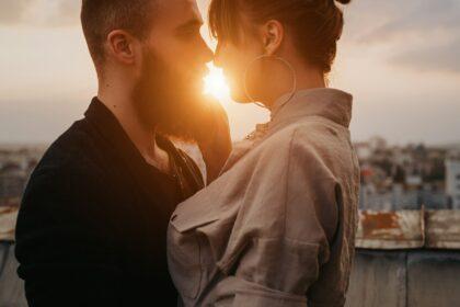 Young couple kissing during evening date