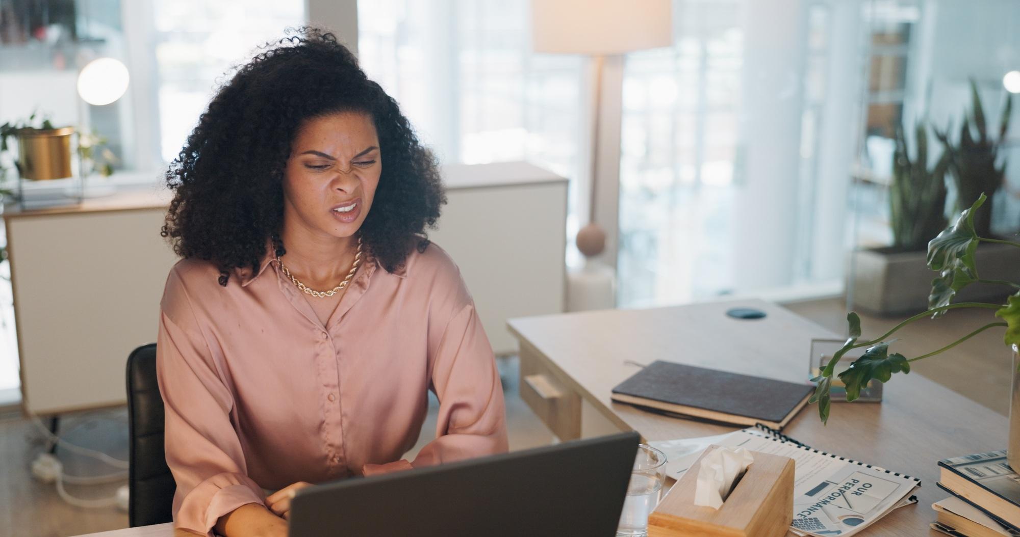 Laptop, business and black woman stress, tired or headache in office fatigue, anxiety or depression